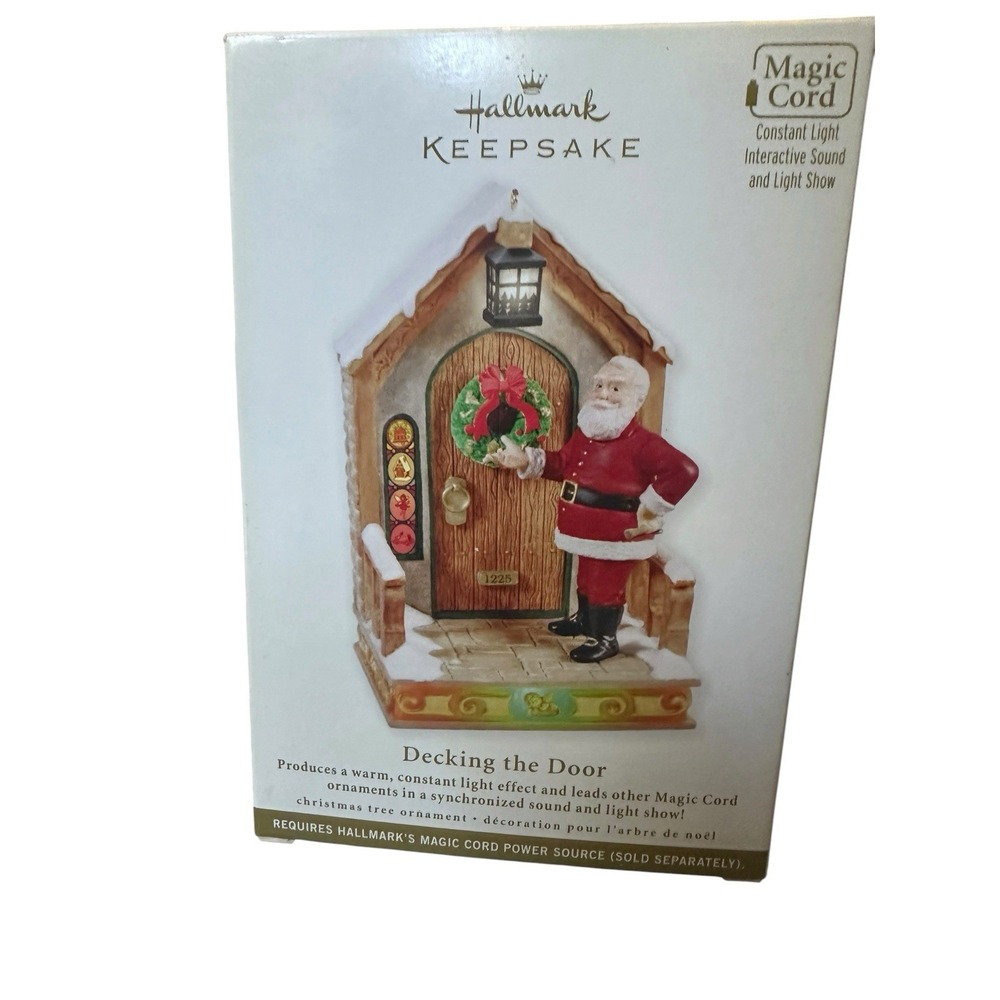 NIB Hallmark Keepsake Once Upon A Christmas Decking The Door Magic Ornament 2011